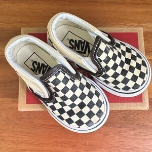 Vans Black and White Checkerboard Slip-On Sneakers